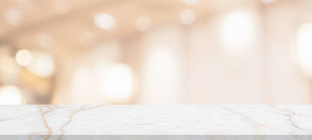 istock marble table top with blurred abstract cafe restaurant interior background 1307657317