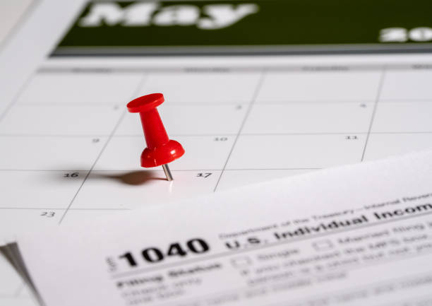 istock Tax Day concept for May 17 2021 using calendar and push pin 1307662687