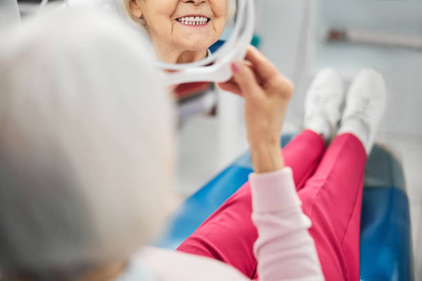 istock Teeth of aged lady in a little mirror 1307665947