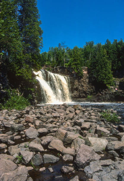 istock Gooseberry Falls State Park - Vertical With Foreground Rocks - 1988 1307670930