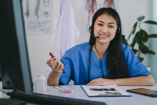 istock Female Medical Professional Using Technology for Meeting with Patients using Online Video 1307671786