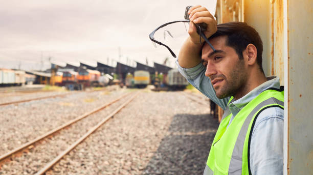 istock Railway Industry Engineer standing beside the Freight Train. 1307673412