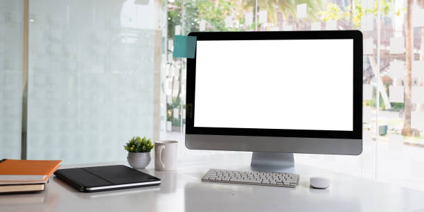 istock White blank screen monitor on modern working desk. 1307675119