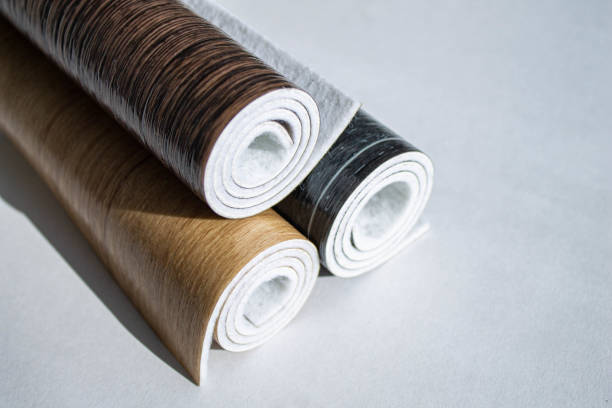 istock Linoleum. Three rolls of linoleum on a white background. 1307676618