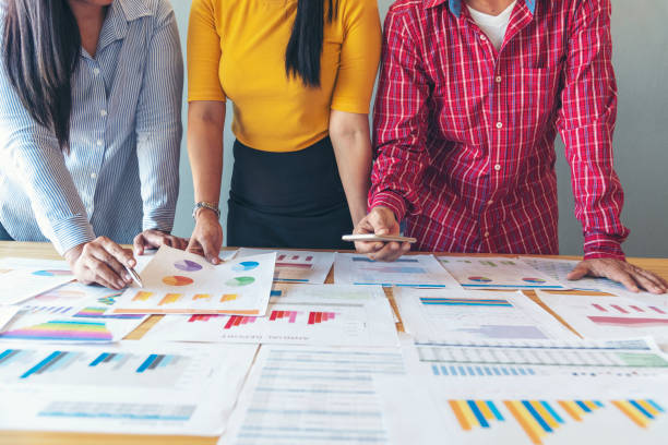 istock Business strategy team report chart, graph, infographic data analyze financial report plan. Hands team partner planning marketing finance statistics sale report with excel spreadsheet accountting 1307677412