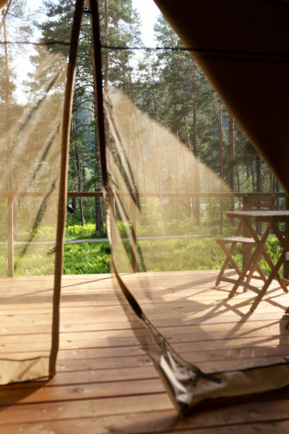 istock View from the glamping tent on the table and chairs on the terrace 1307678997