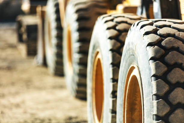 Heavy Machinery Construction Zone Tires Work Western USA Photo Series Grader and Front End Loader Tires Heavy Machinery Construction Zone Work Western USA Photo Series Matching 4K Video Available (Shot with Canon 5DS 50.6mp photos professionally retouched - Lightroom / Photoshop - original size 5792 x 8688 downsampled as needed for clarity and select focus used for dramatic effect) mining equipment stock pictures, royalty-free photos & images