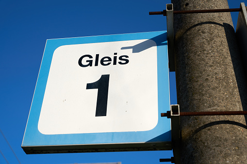 Sign with the inscription track 1 (Gleis 1) at a small station in a village near Magdeburg in Germany