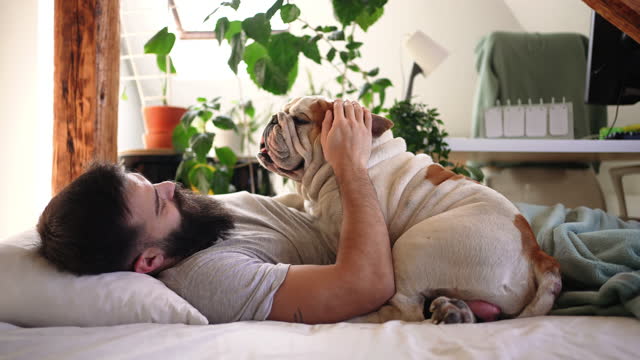 Young man waking up with his dog