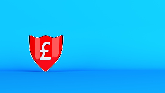Finance concept Red-colored shield and white-colored pound symbol On blue-colored background Horizontal composition with copy space