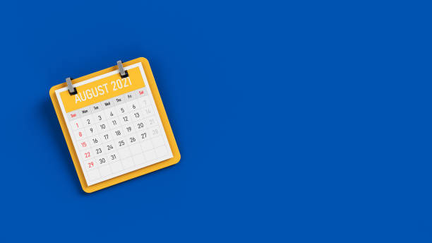 Yellow-colored tiny calendar on blue-colored background Horizontal composition with copy space The yellow-colored tiny calendar on blue-colored background Horizontal composition with copy space august photos stock pictures, royalty-free photos & images