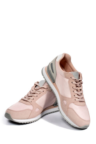 istock Light pink summer sneakers on a white background 1307689924