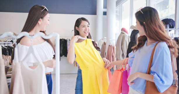 istock women shopping at clothes store 1307691510