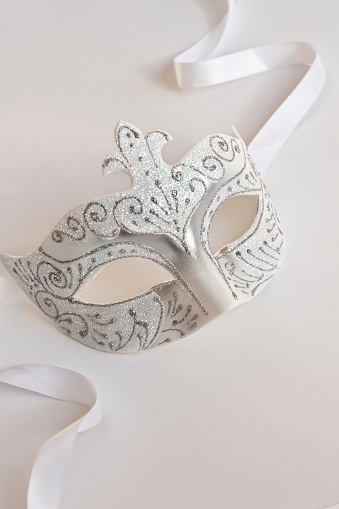 White carnival mask on white backgroun