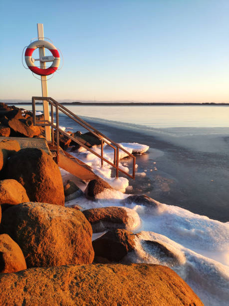 istock ice winter sunset over open water 1307695642