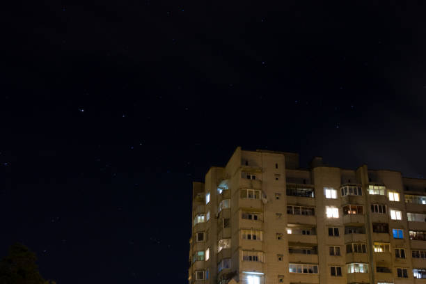istock Night sky with stars and clouds, blurred background 1307695672