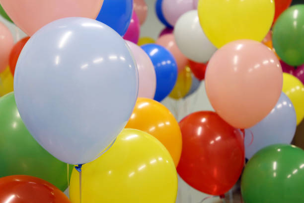 istock Helium balloons with ribbons in the office 1307696411