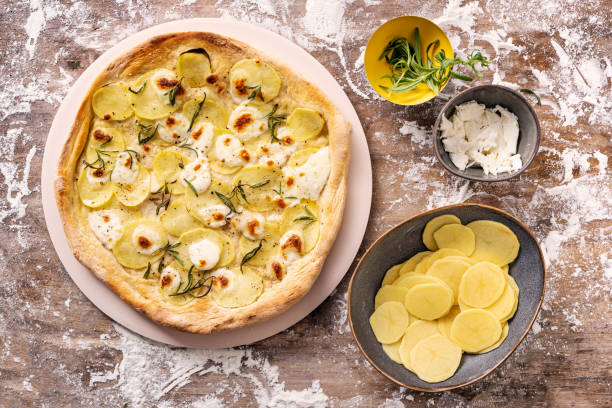istock Overhead View of a Freshly Baked Potato Pizza 1307696449