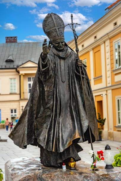 Pope John Paul II statue by sculptor Maksymilian Biskupski in Wadowice historic city center in Lesser Poland Wadowice, Poland - August 27, 2020: Pope John Paul II statue by sculptor Maksymilian Biskupski in front of papal basilica at Market square in Wadowice historic city center in Lesser Poland beskid mountains photos stock pictures, royalty-free photos & images