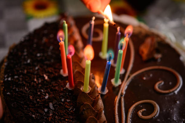 istock Name cake with colored burning candles, holiday and mood. 1307701080