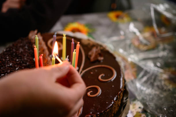 istock Name cake with colored burning candles, holiday and mood. 1307701118