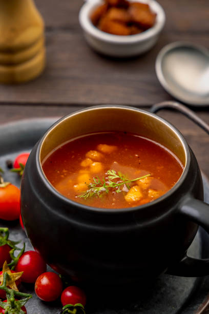 istock Homemade tomato soup with tomatoes, herbs and spices 1307701787