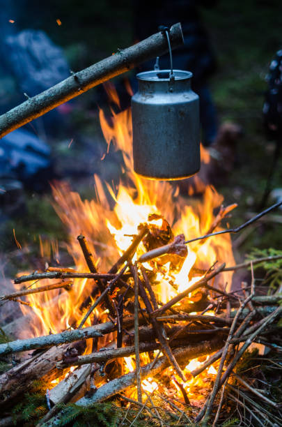 istock Old milk can is heated on a bonfire 1307702072