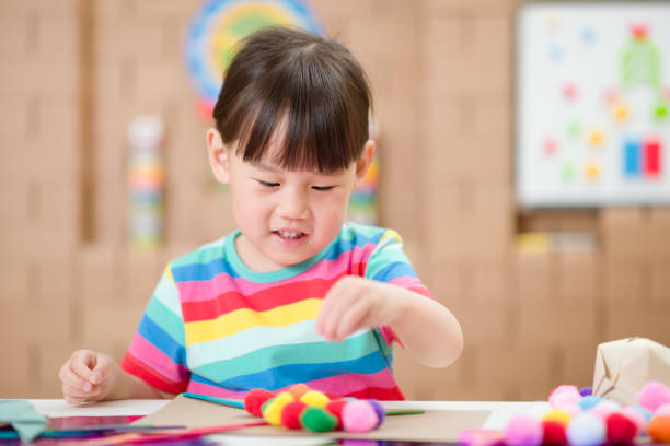 istock Young Girl Making Craft For Homeschooling 1307702378