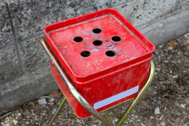 Simple smoking area with a red outdoor ashtray