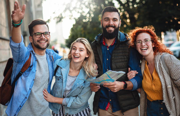 istock Group of young friends having fun walking on city. 1307707573