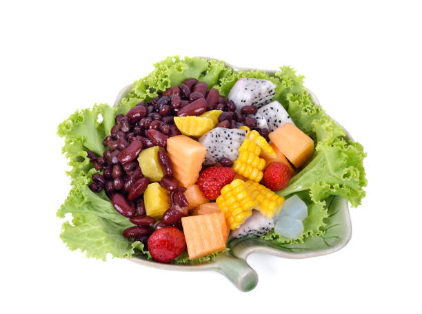 istock fresh vegetable salad isolated on white background 1307707651