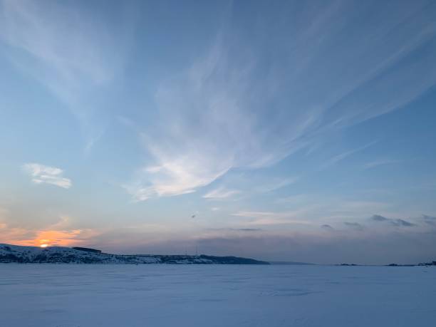 istock Sunset over the winter field 1307708394