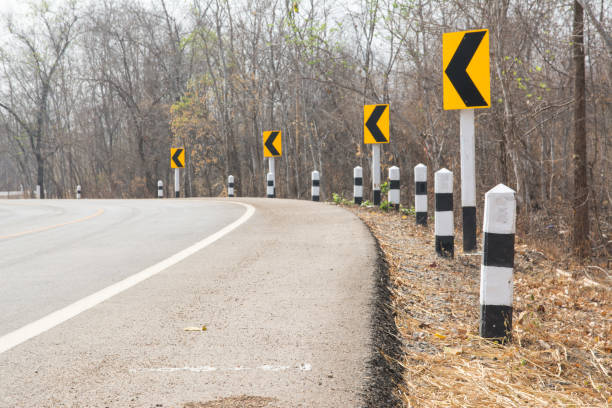 istock Traffic sign and Asphalt road in Autumn forest 1307710403