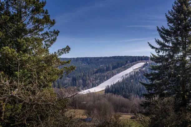 A ski run in the mountains in the spring