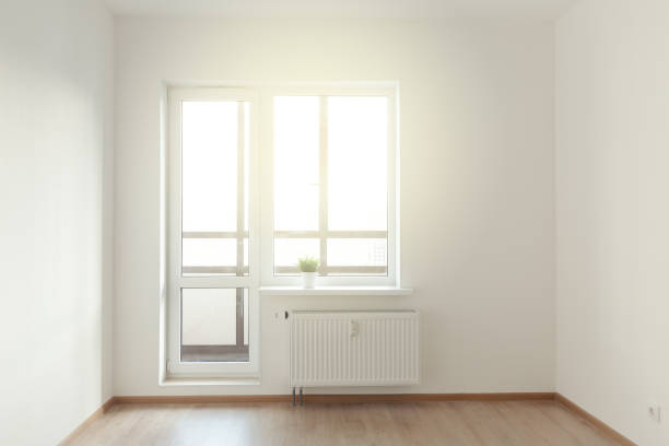istock White wall interior and window view. Property Estate concept 1307710967