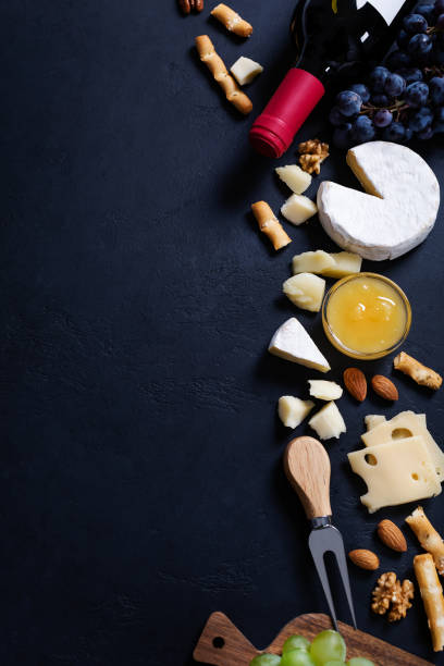 istock Different sorts of cheese on black background 1307711269