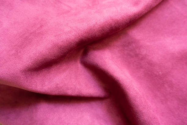 istock Folded bright cerise colored faux suede fabric 1307711271