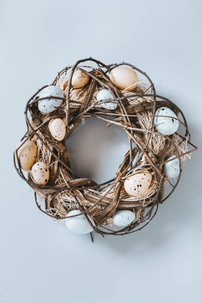 istock Easter door wreath decorated with eggs and woven twigs. 1307712963