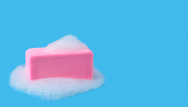 istock Soap and sud on blue background. 1307713046