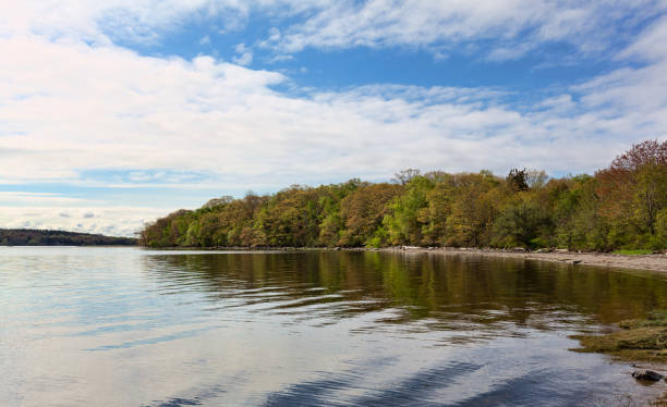 istock Sears Island with clouds and blue sky above 1307716880