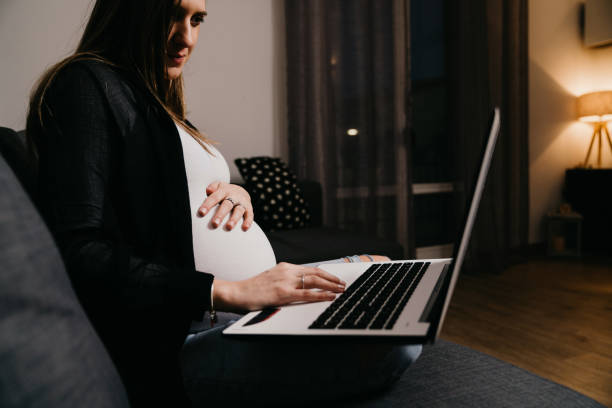 istock Pregnant woman working from home 1307719374