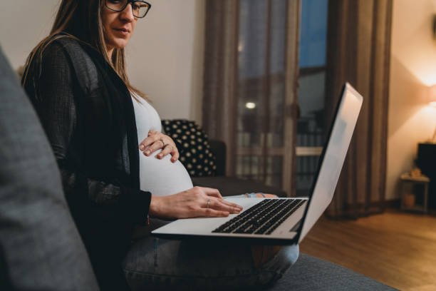 istock Pregnant woman working from home 1307719383