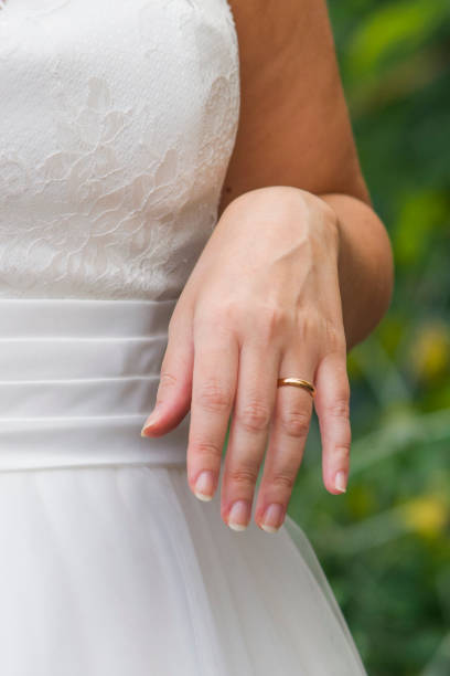 istock young spouses play with love rings that they have given themselves 1307719393