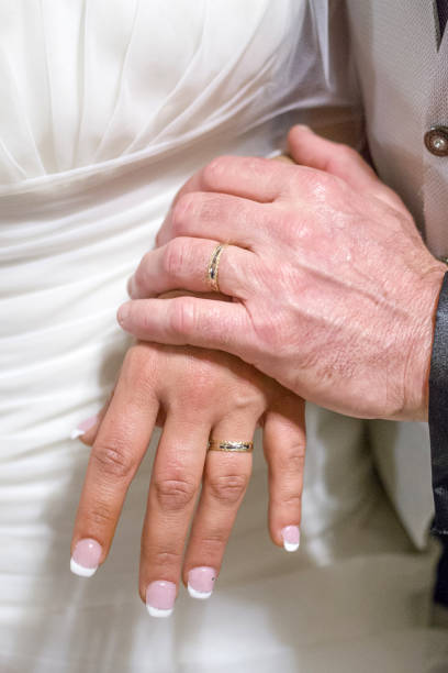 istock young spouses play with love rings that they have given themselves 1307719406