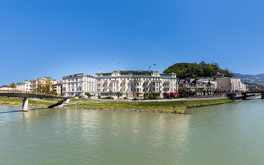 Salzburg, Austria - April 21, 2015: Hotel Sacher at Salzach river in Salzburg, Austria. The hotel was built between 1863 to 1866 by the hotelier and master builder Carl Freiherr.