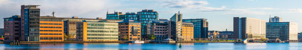 istock Modern office buildings city skyline overlooking harbor waterfront panorama 1307720433