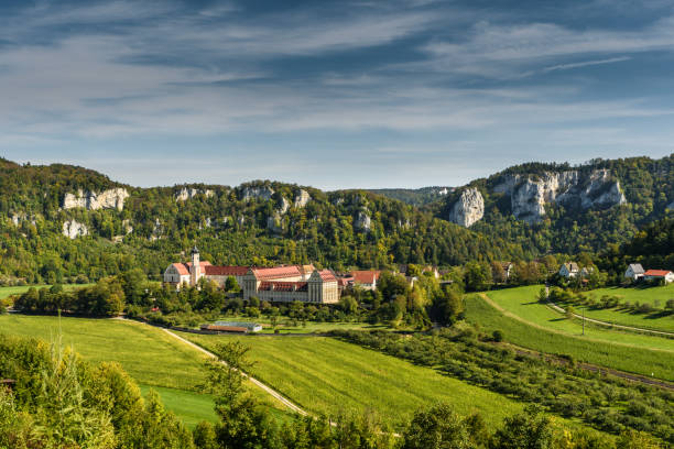 Upper Danube Valley with Beuron Monastery, Benedictine Archabbey, Swabian Alb, Sigmaringen district, Baden-Wuerttemberg, Germany Beuron, Baden-Wuerttemberg, Germany - September 30 ,2020. View of the Benedictine monastery of St. Martin zu Beuron in the Upper Danube Nature Park. Wildenstein Castle can be seen on a hill in the background. beuron stock pictures, royalty-free photos & images