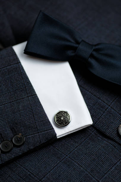 istock Luxury bow tie close up with vintage suit and cufflink. 1307721025