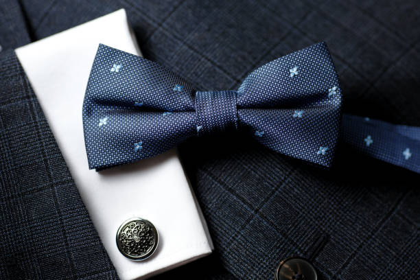 Luxury bow tie close up with vintage suit and cufflink. stock photo