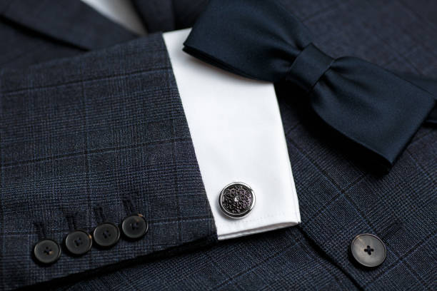 istock Luxury bow tie close up with vintage suit and cufflink. 1307721029